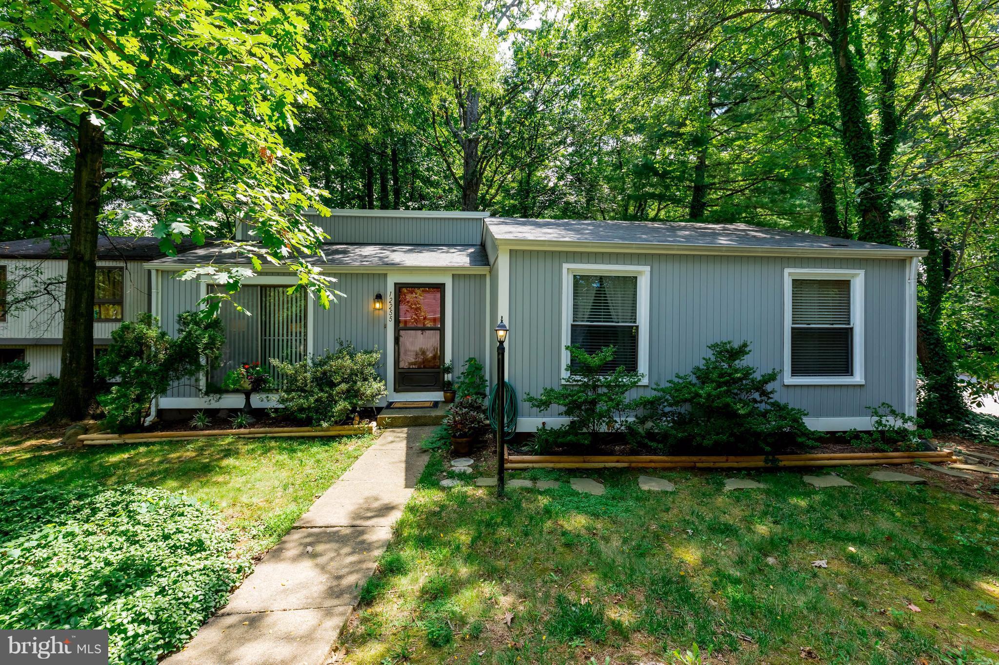 12255 Turkey Wing Court Reston, VA 20191 - Photo 1 of 30 a view of a house with backyard and garden
