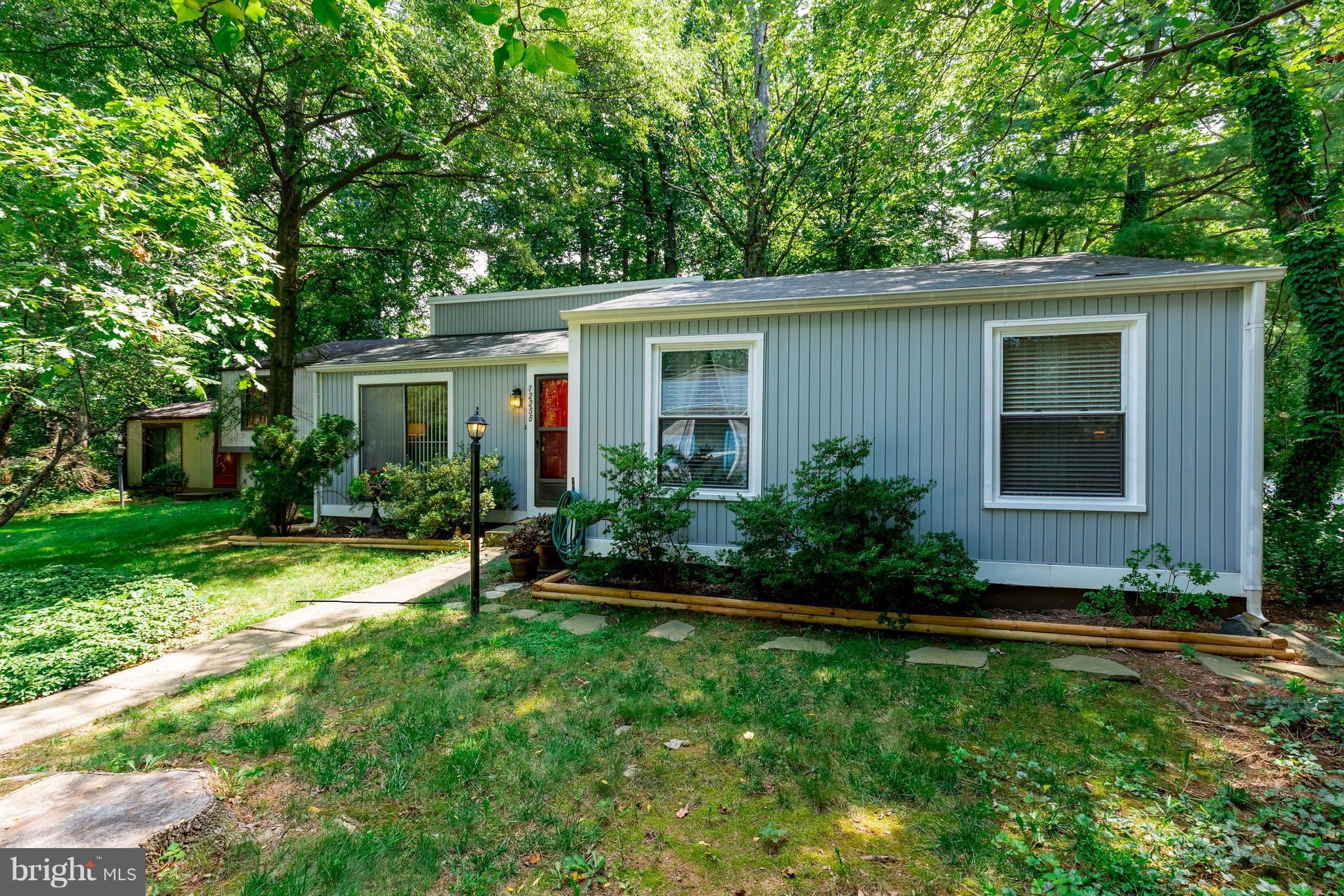 12255 Turkey Wing Court Reston, VA 20191 - Photo 2 of 30 a front view of house with yard and green space