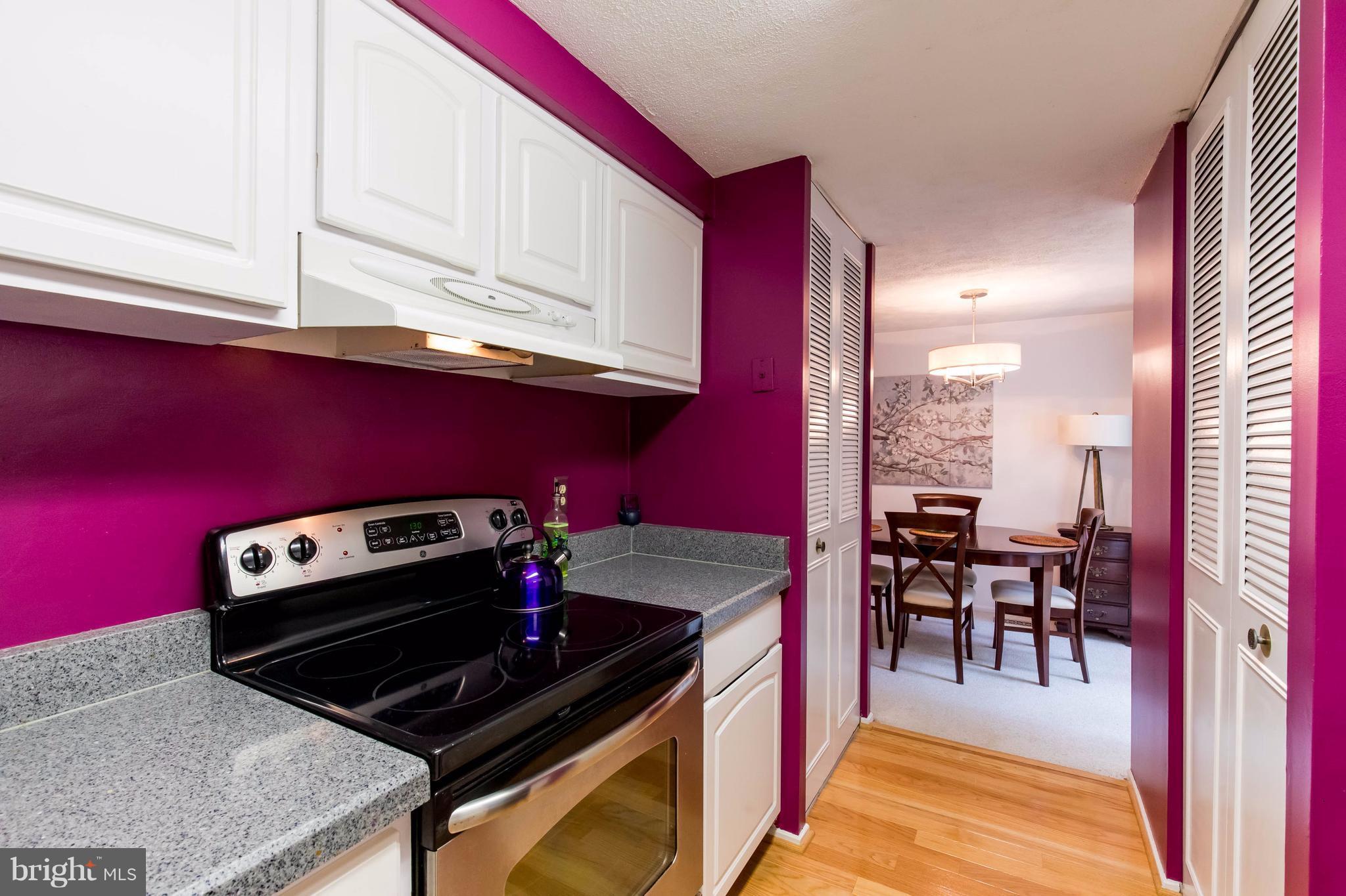 12255 Turkey Wing Court Reston, VA 20191 - Photo 13 of 30 a kitchen with a stove and a microwave