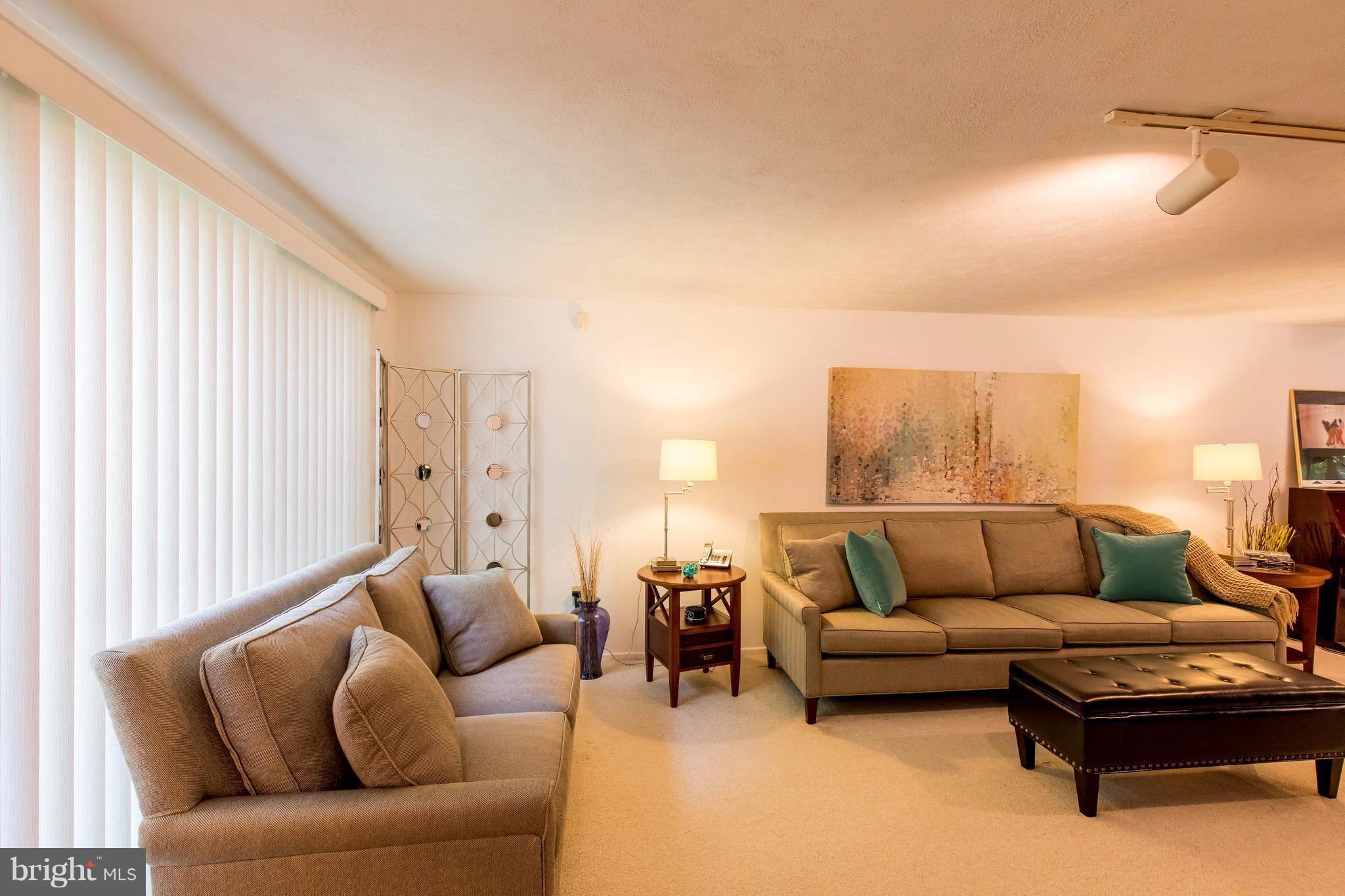 12255 Turkey Wing Court Reston, VA 20191 - Photo 3 of 30 a living room with furniture and a large window