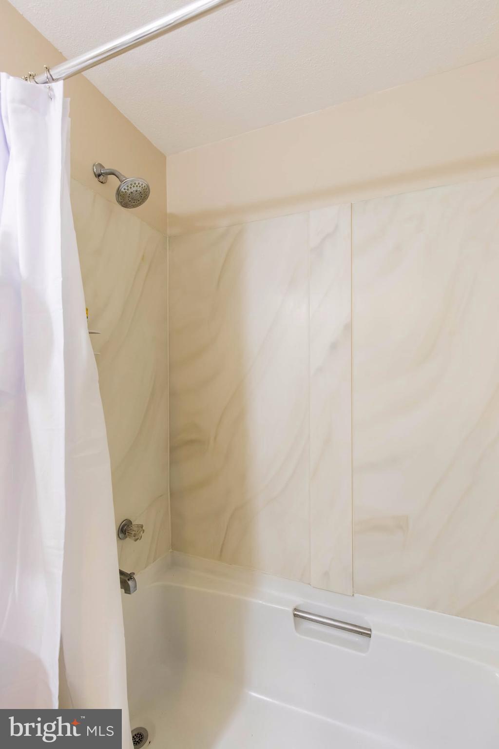 12255 Turkey Wing Court Reston, VA 20191 - Photo 22 of 30 a bathroom with a shower