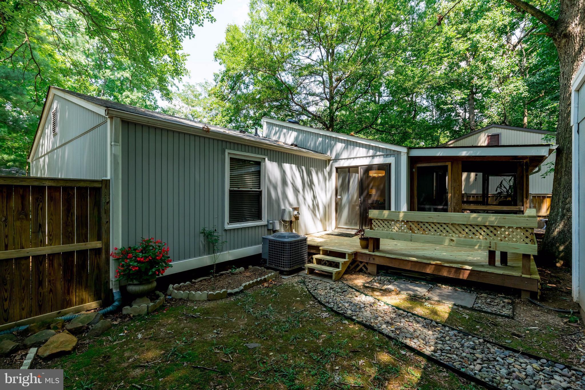 12255 Turkey Wing Court Reston, VA 20191 - Photo 28 of 30 a view of a house with backyard and sitting area