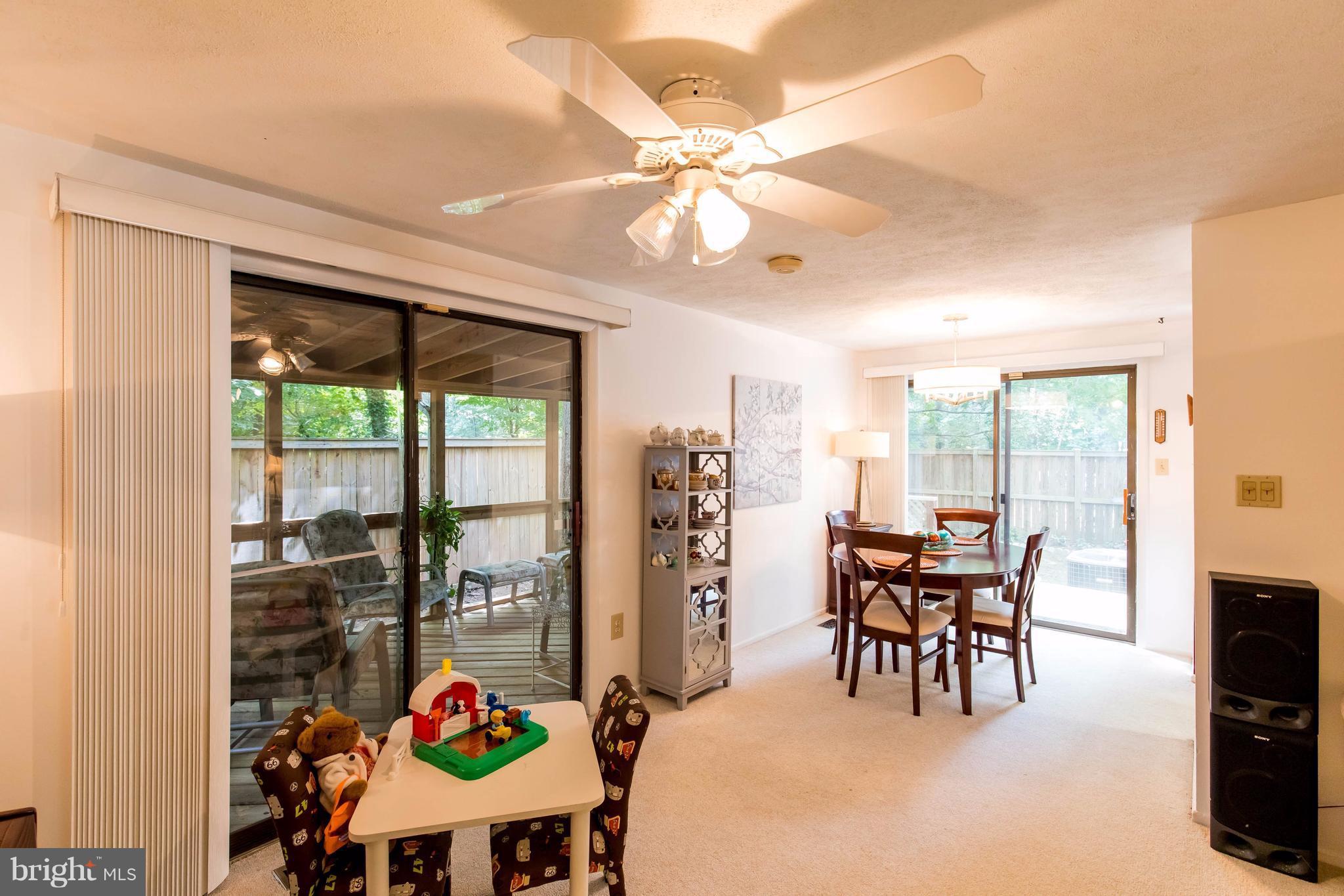 12255 Turkey Wing Court Reston, VA 20191 - Photo 8 of 30 a dining room with furniture mountain view and a potted plant