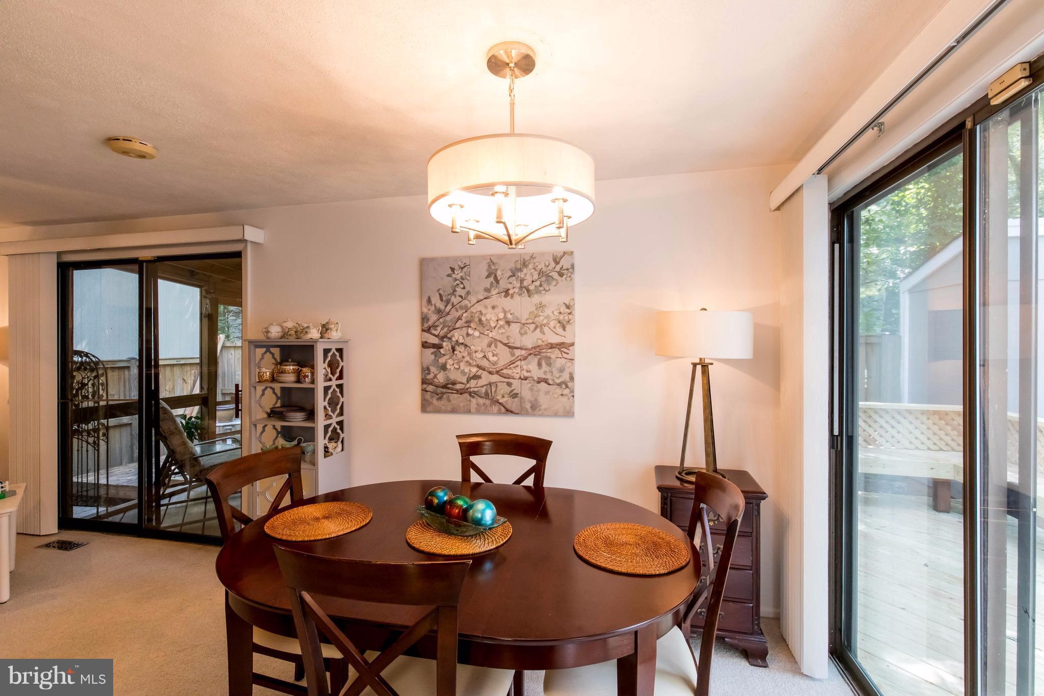 12255 Turkey Wing Court Reston, VA 20191 - Photo 9 of 30 a view of a dining room with furniture window and outside view