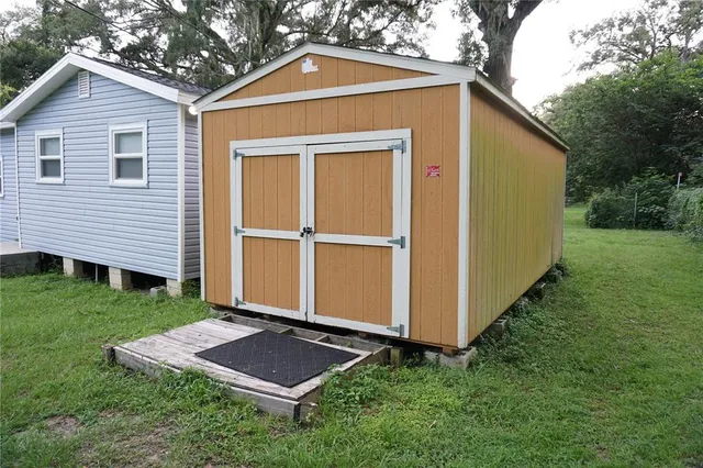 a view of backyard with a garden and plants