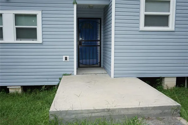 a view of a backyard of the house