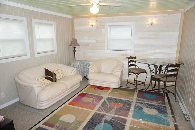 a living room with furniture and a rug