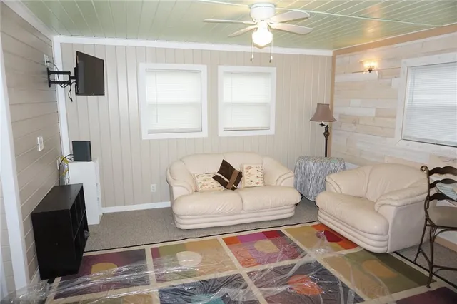 a living room with furniture and a rug