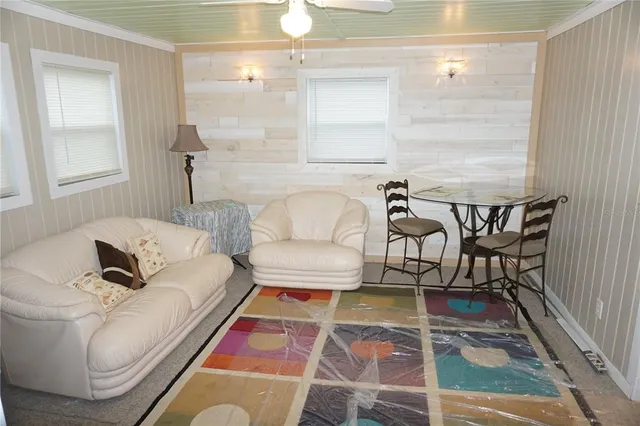 a living room with furniture and a rug