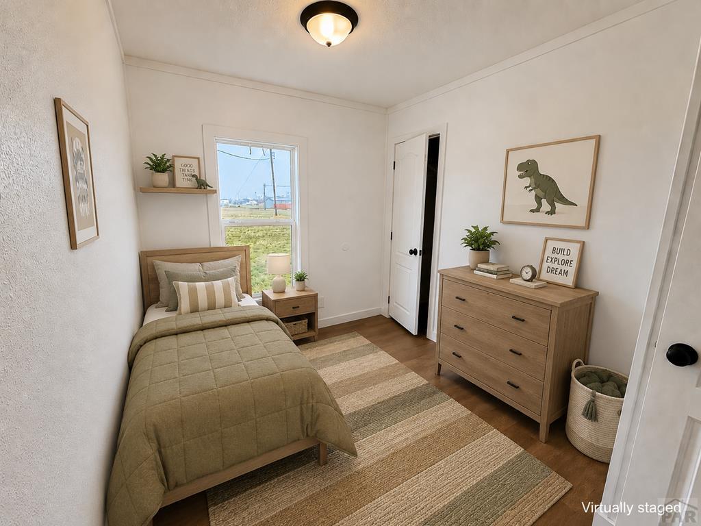 6652 County Rd HH.5 Lamar, CO 81052 - Photo 17 of 22 a bedroom with furniture and window