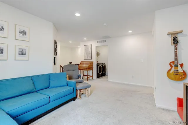 a view of a patio with couches chairs and a potted plant