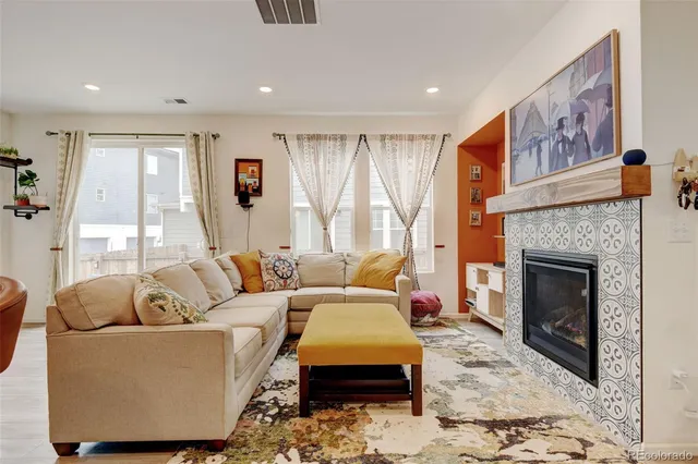 a living room with furniture and a large window