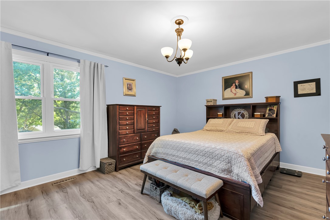1305 Hanover Road Anderson, SC 29621 - Photo 12 of 29 Warm wood flooring and classic crown molding define this serene sleeping space.
