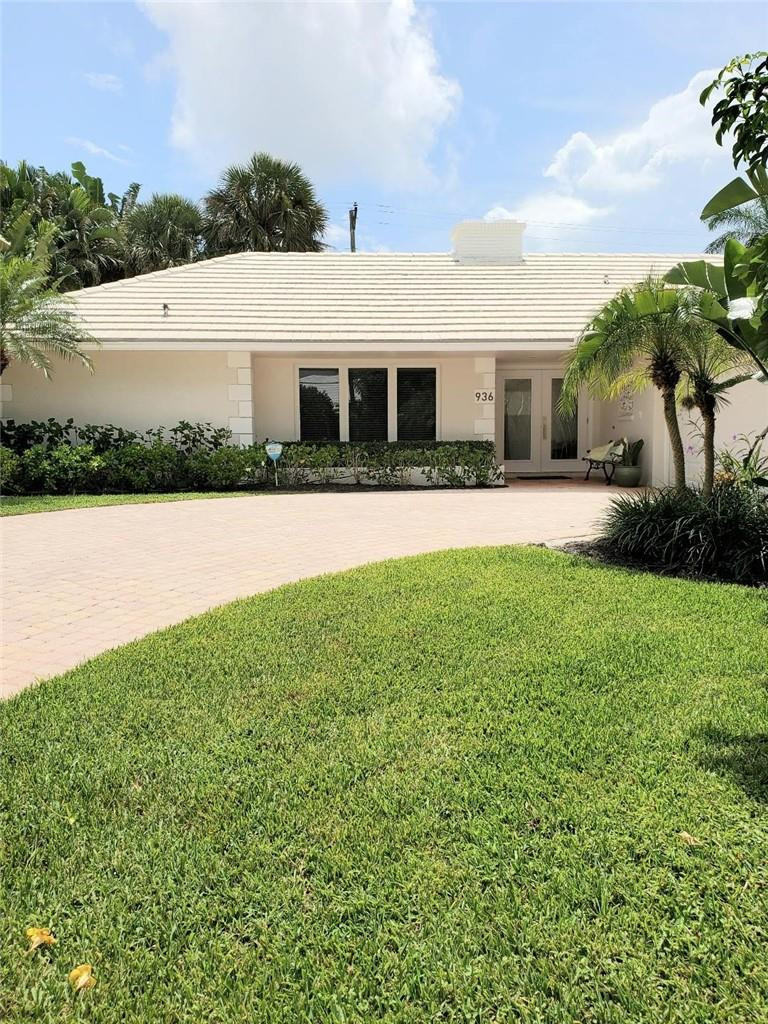 936 Hickory Terrace Boca Raton, FL 33486 - Photo 1 of 7 a front view of a house with a yard and garage