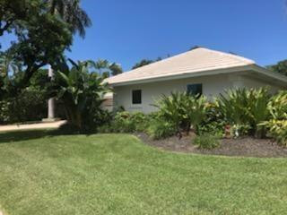 936 Hickory Terrace Boca Raton, FL 33486 - Photo 3 of 7 a view of a house with a yard