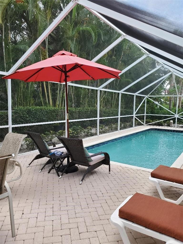 936 Hickory Terrace Boca Raton, FL 33486 - Photo 7 of 7 a view of outdoor space with swimming pool and furniture