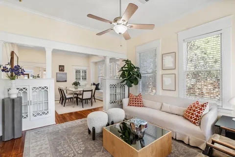 a living room with stainless steel appliances kitchen island granite countertop a dining table chairs and view living room