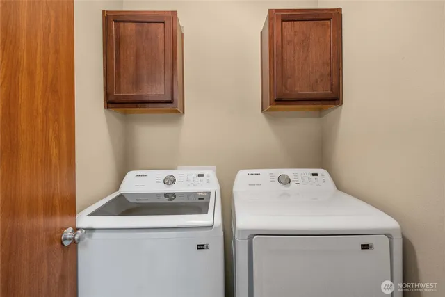 a utility room with dryer and washer
