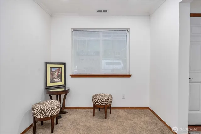 a room with chair and a window