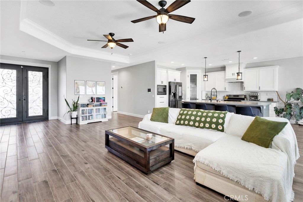 12634 Spring Valley Parkway Victorville, CA 92395 - Photo 13 of 42 a living room with furniture and kitchen view