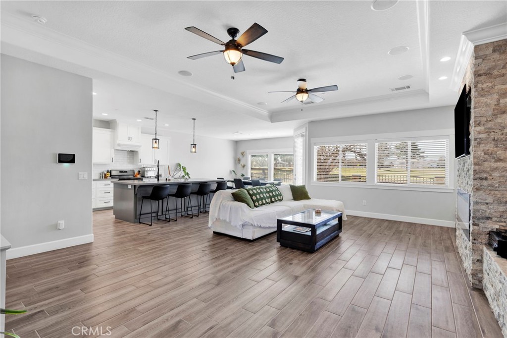 12634 Spring Valley Parkway Victorville, CA 92395 - Photo 14 of 42 a living room with furniture and wooden floor