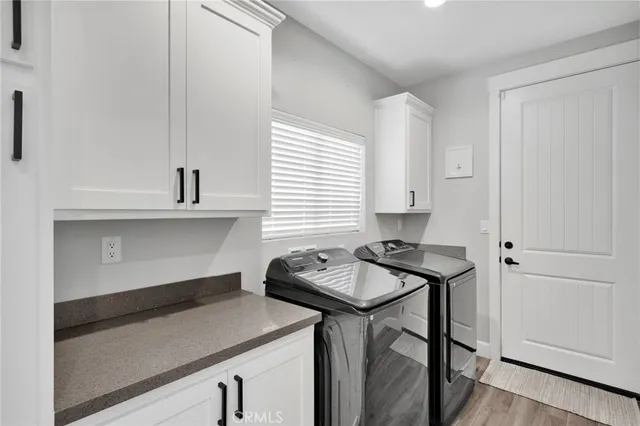 a kitchen with a sink a stove and cabinets