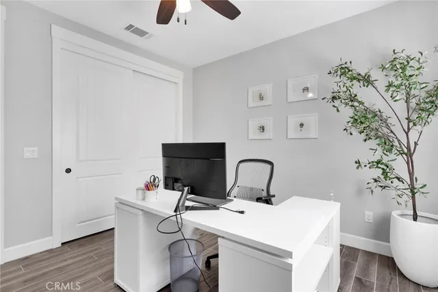 a view of a workspace with furniture