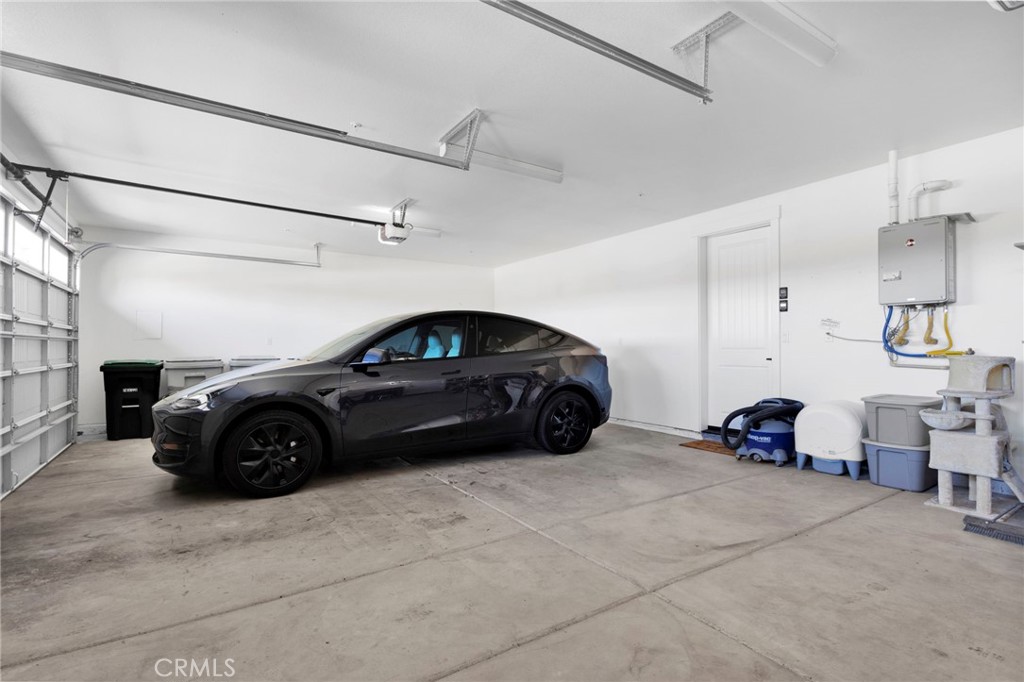 12634 Spring Valley Parkway Victorville, CA 92395 - Photo 35 of 42 a car parked in a garage