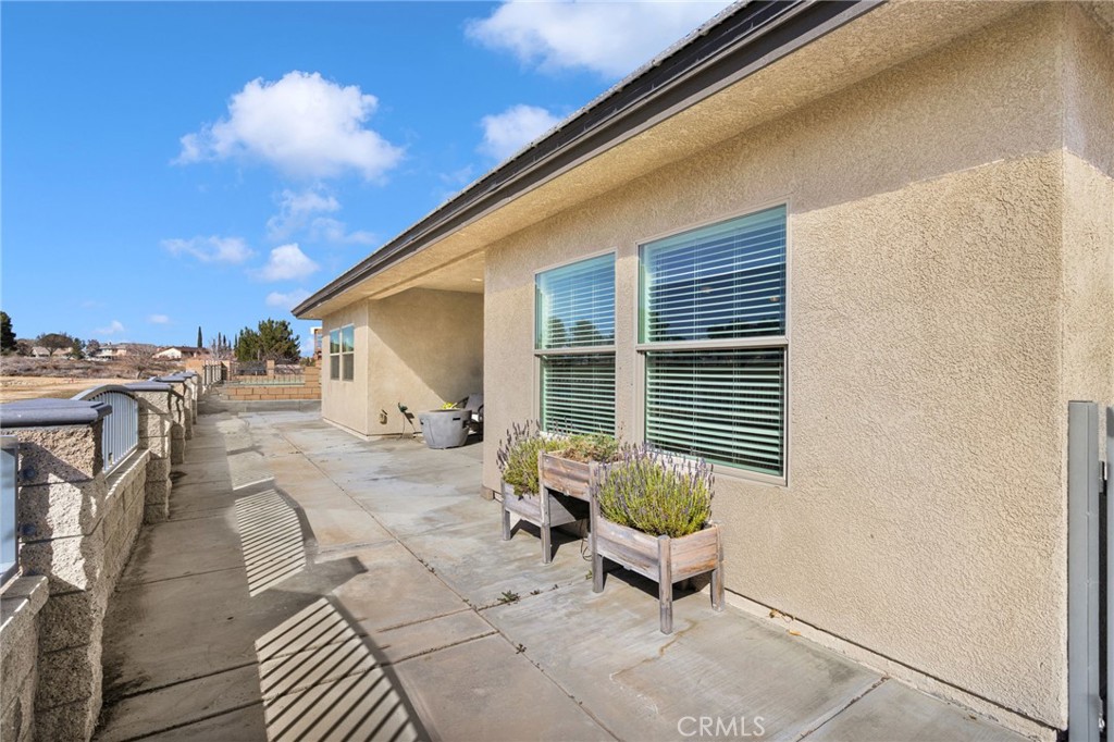 12634 Spring Valley Parkway Victorville, CA 92395 - Photo 38 of 42 a backyard of a house with outdoor seating