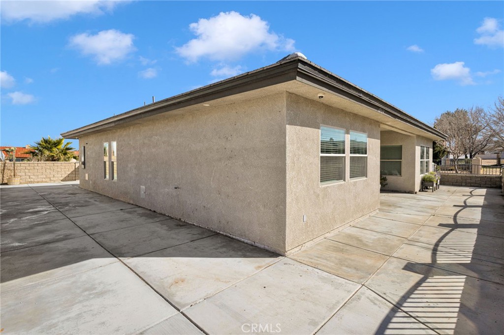12634 Spring Valley Parkway Victorville, CA 92395 - Photo 41 of 42 a front view of a house with a yard