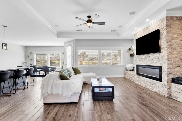 a living room with furniture fireplace and flat screen tv