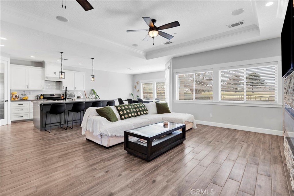 12634 Spring Valley Parkway Victorville, CA 92395 - Photo 9 of 42 a living room with furniture and wooden floor