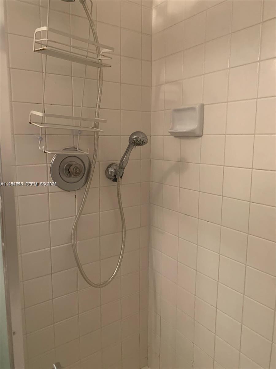 10009 Winding Lake Road, Unit 106 Sunrise, FL 33351 - Photo 7 of 7 a bathroom with a shower