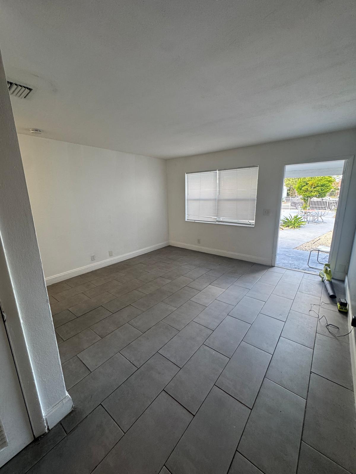 914 3rd Street, Unit 4 West Palm Beach, FL 33401 - Photo 4 of 17 an empty room with windows