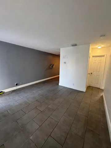 an empty room with a bench