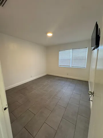 a view of an empty room with a window