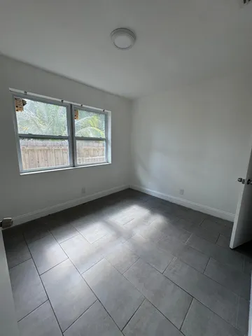 a kitchen with a refrigerator and a sink