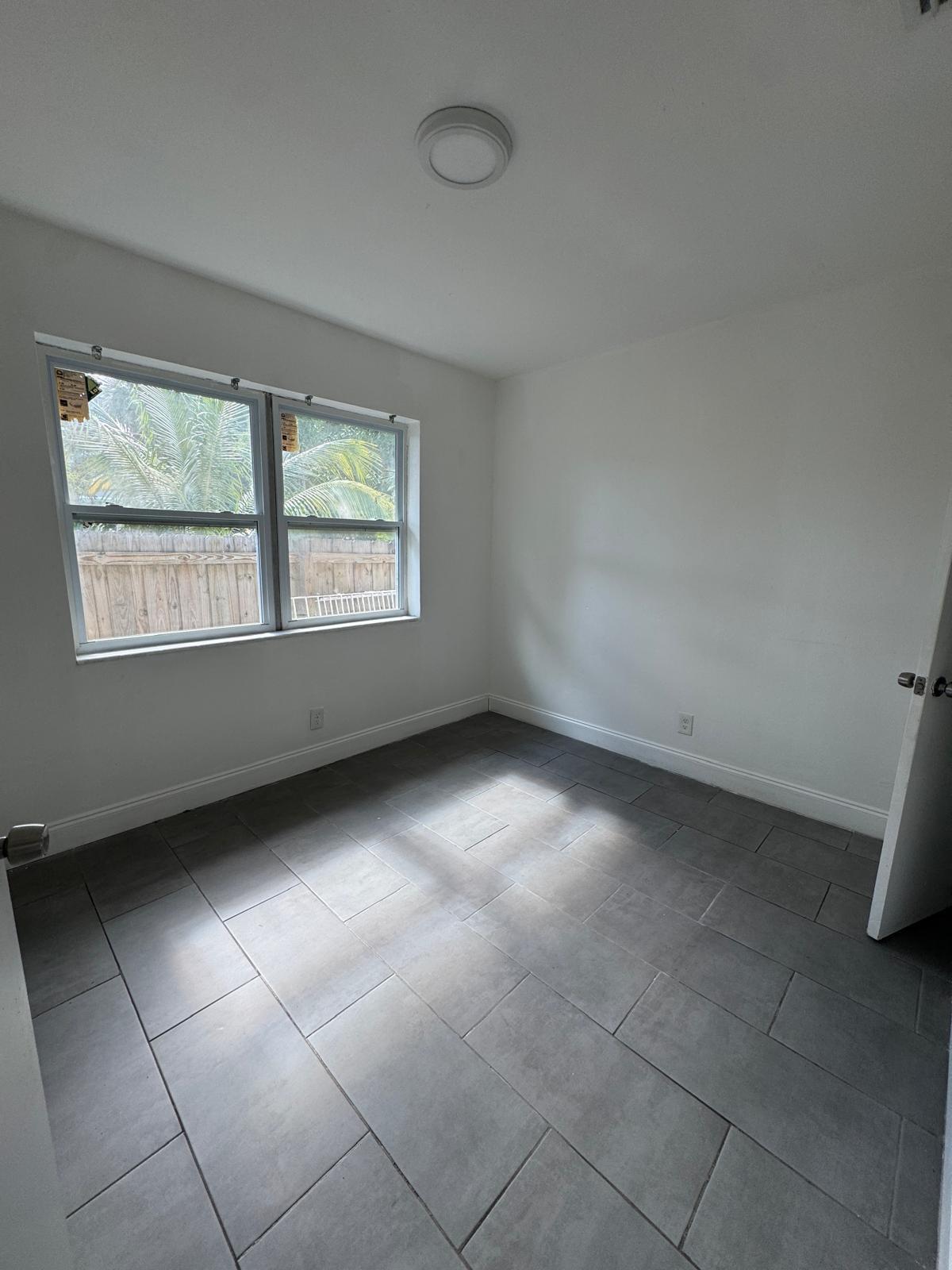 914 3rd Street, Unit 4 West Palm Beach, FL 33401 - Photo 8 of 17 a view of an empty room with a window