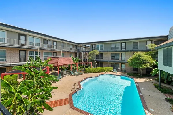 a front view of a house with a yard table and chairs