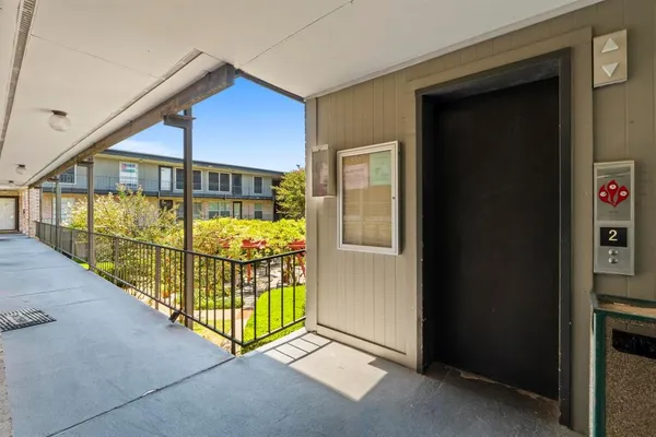 a view of a porch with a small yard