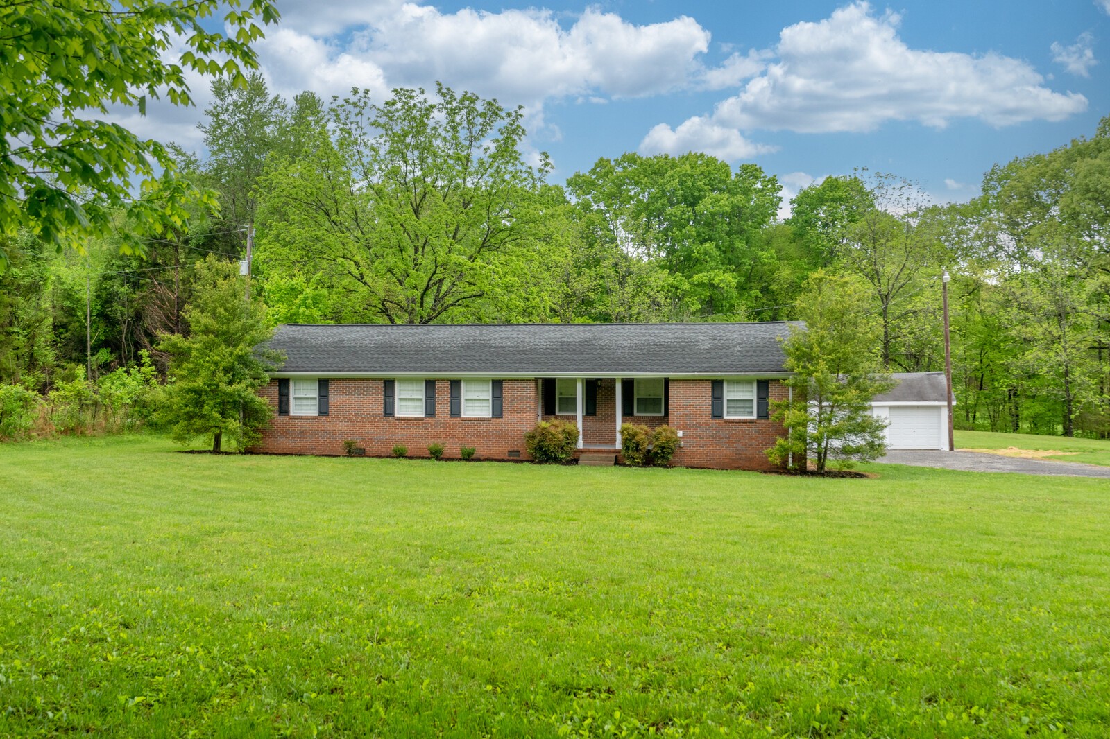 373 S Road Cottontown, TN 37048 - Photo 1 of 34 a view of a house with a yard and sitting area