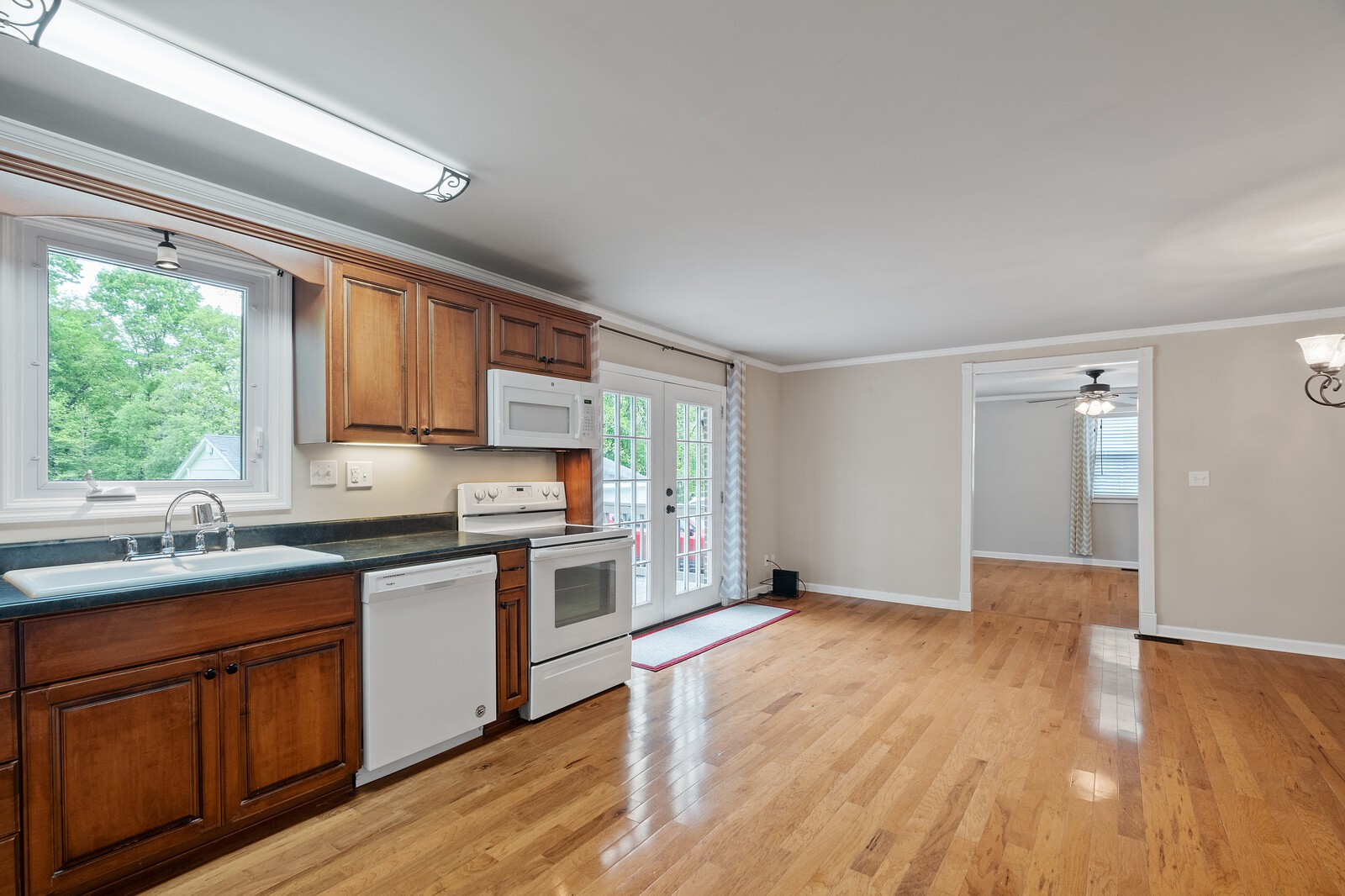 373 S Road Cottontown, TN 37048 - Photo 14 of 34 a kitchen with a sink wooden floor and window