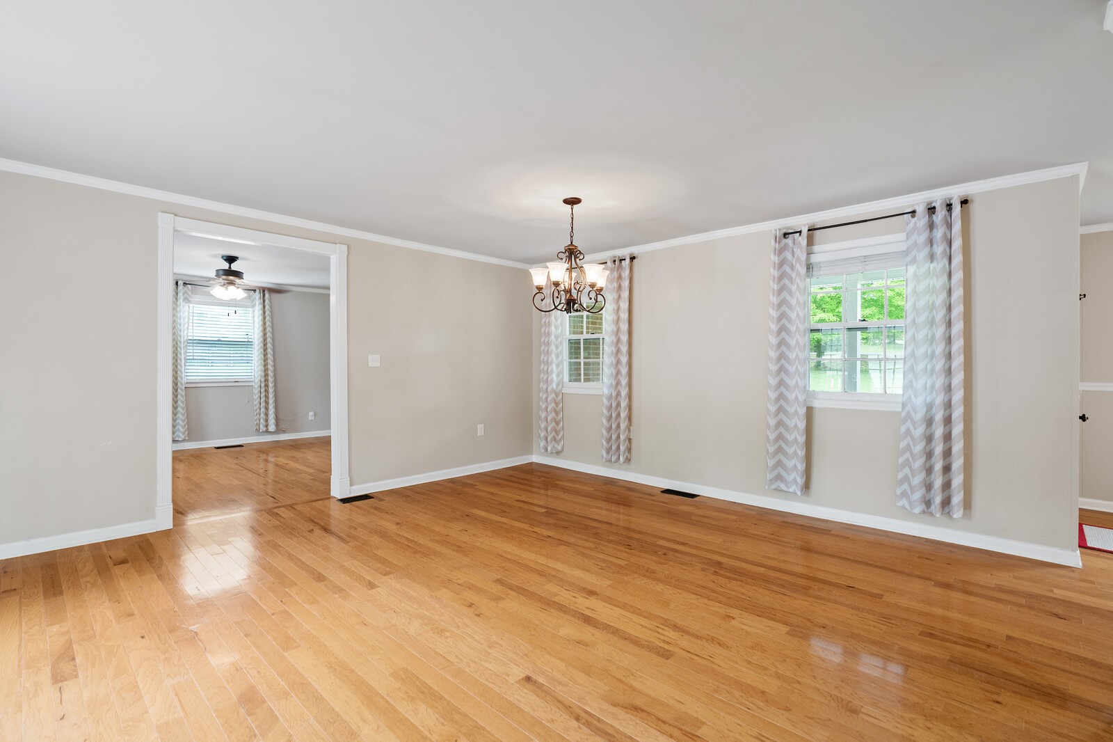 373 S Road Cottontown, TN 37048 - Photo 16 of 34 a view of an empty room with wooden floor and a window