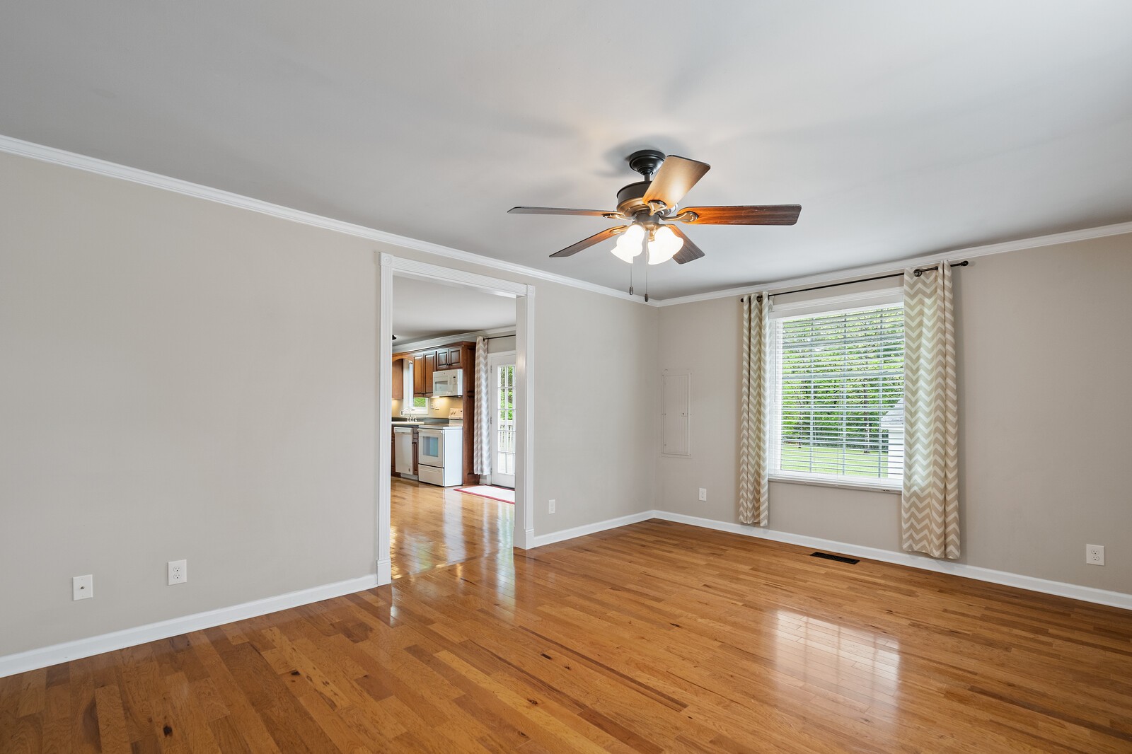 373 S Road Cottontown, TN 37048 - Photo 18 of 34 a view of an empty room with a window and wooden floor