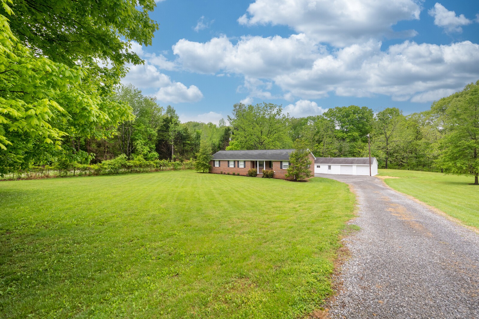 373 S Road Cottontown, TN 37048 - Photo 3 of 34 a view of a house with a big yard