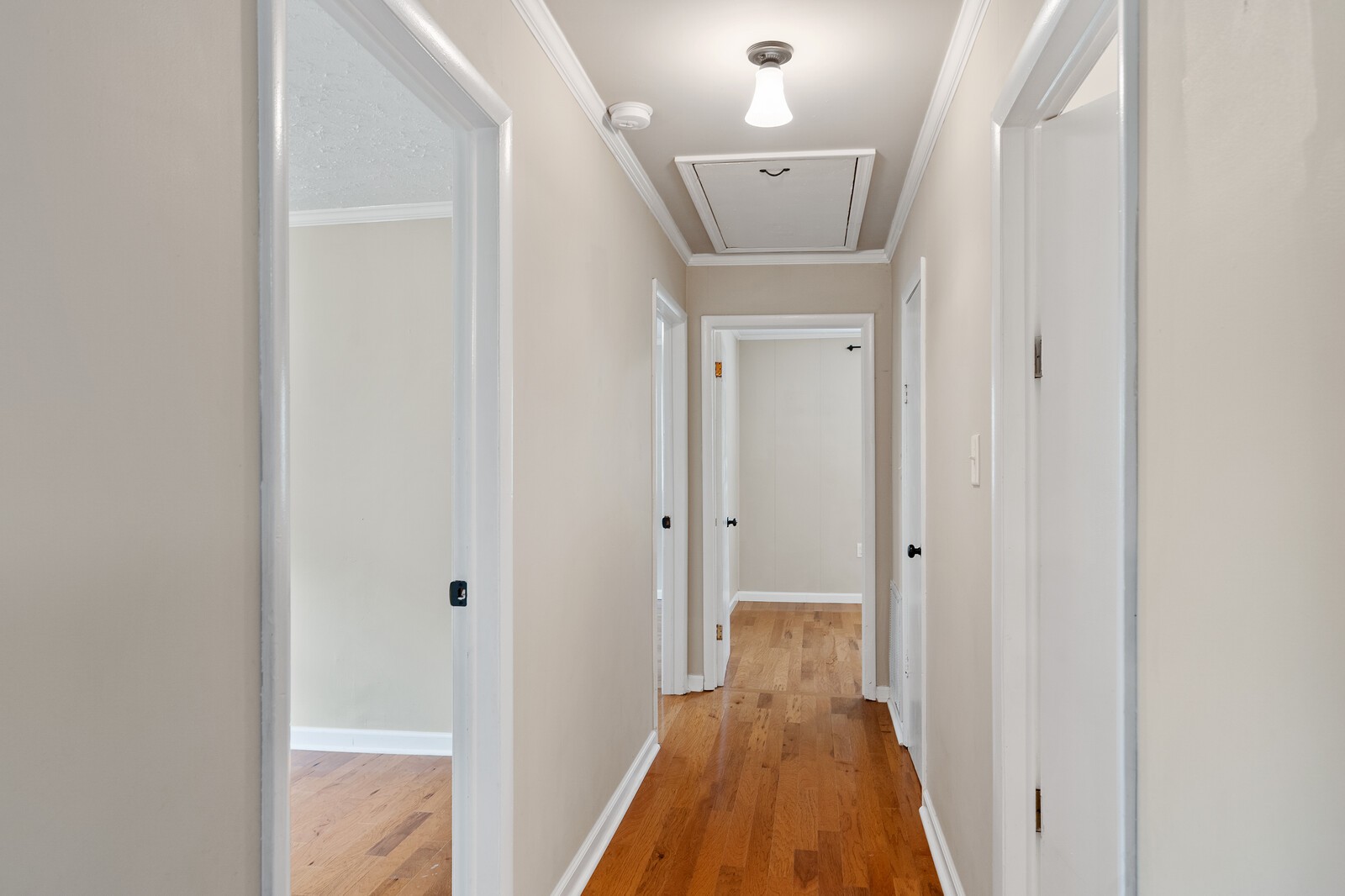 373 S Road Cottontown, TN 37048 - Photo 21 of 34 a view of a hallway with wooden floor and a bathroom