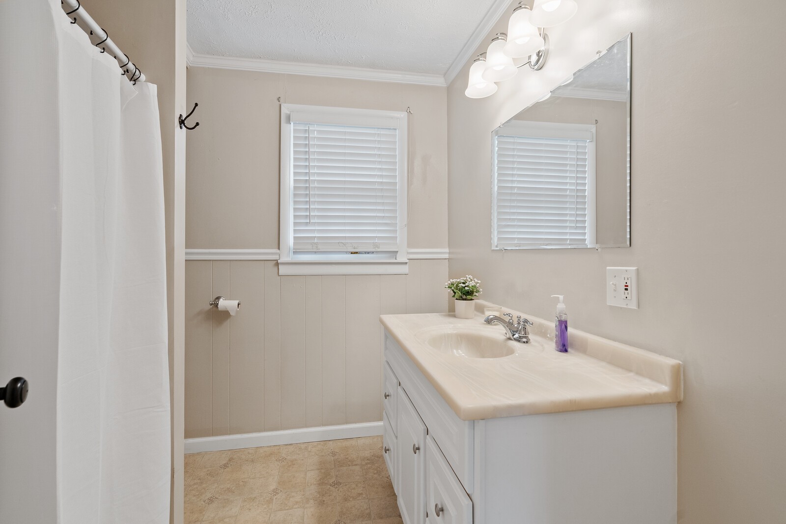 373 S Road Cottontown, TN 37048 - Photo 23 of 34 a bathroom with a sink a vanity and a mirror