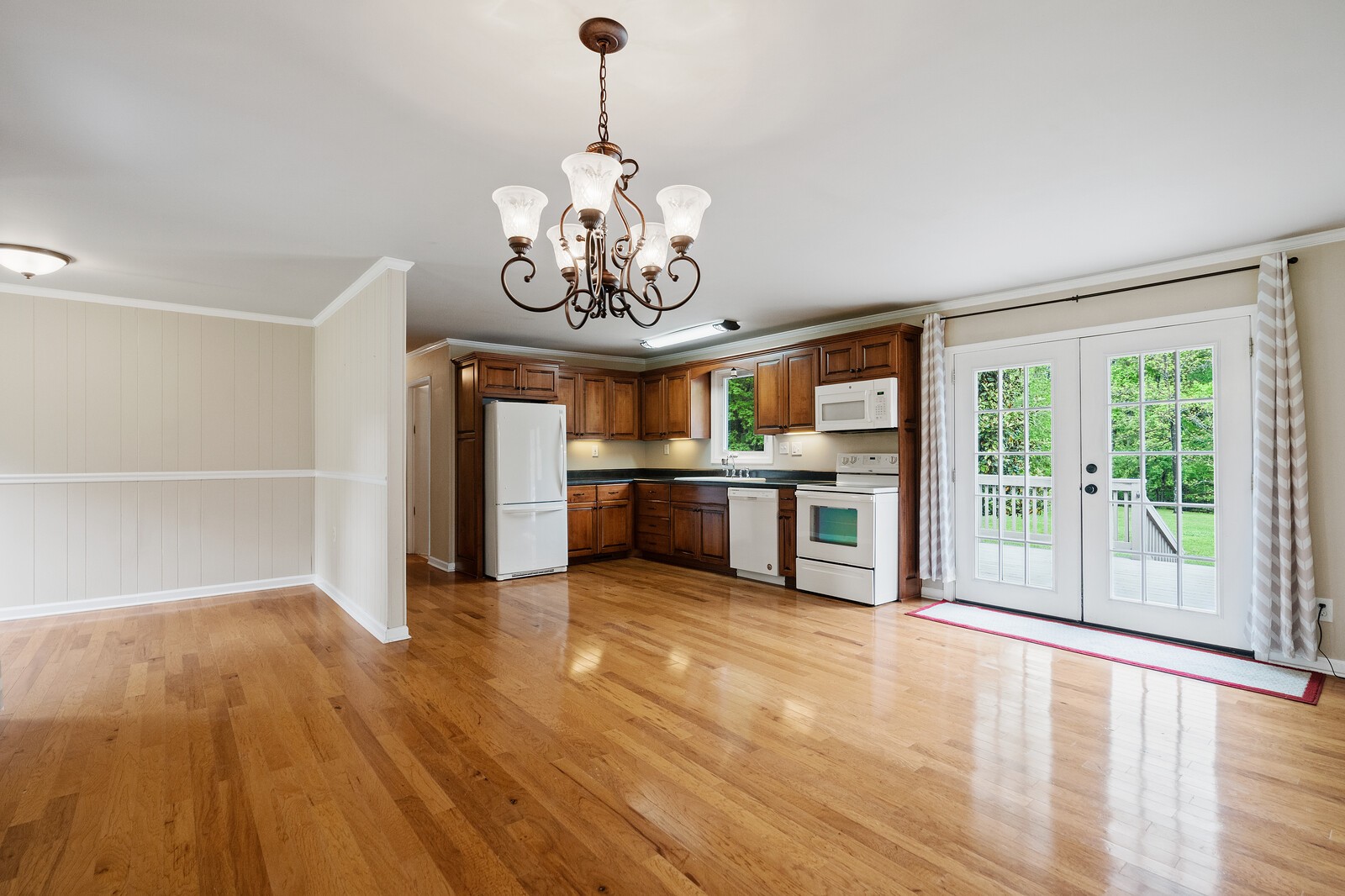 373 S Road Cottontown, TN 37048 - Photo 10 of 34 a view of a kitchen with a sink and dishwasher wooden floor