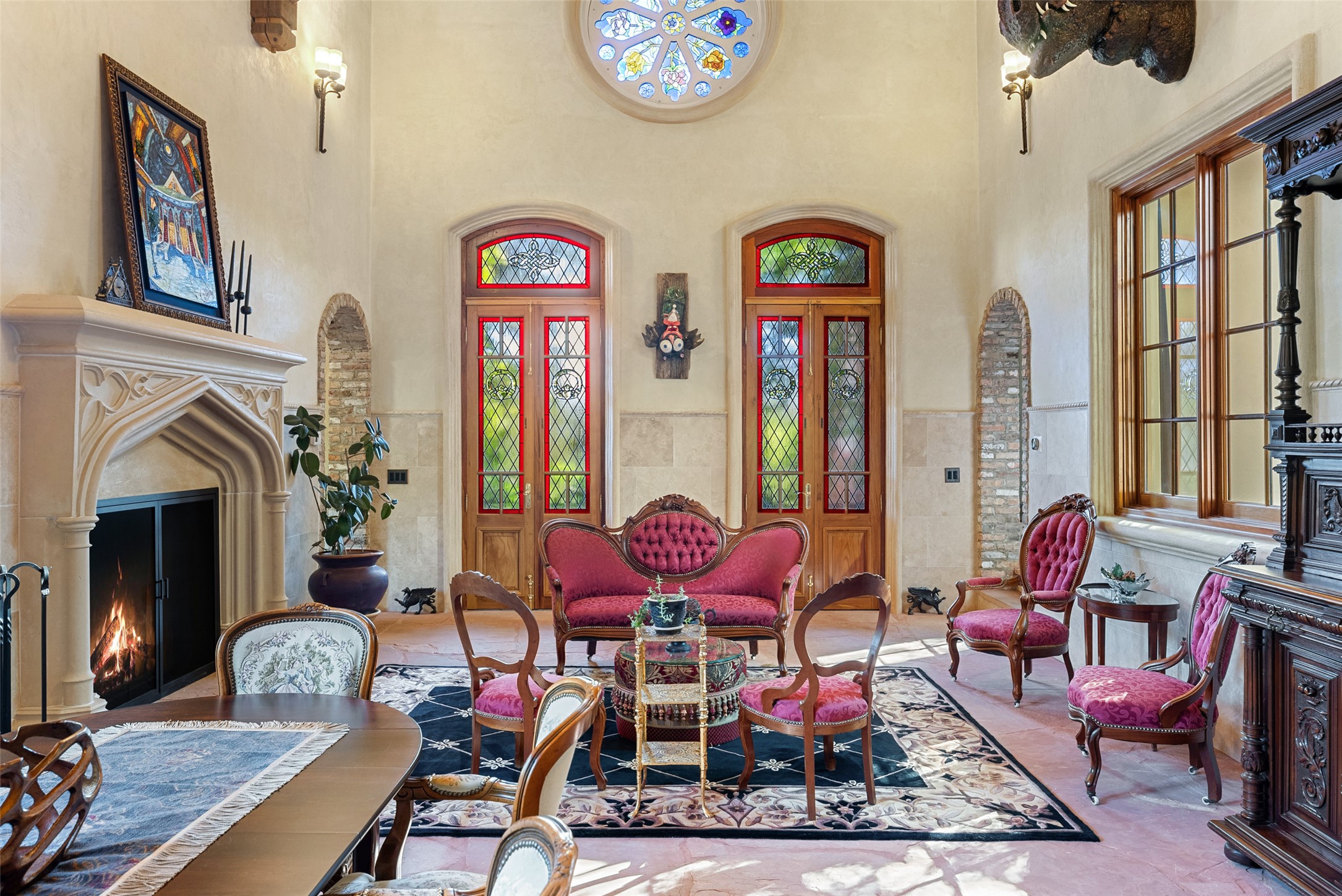 1354 The High Road Austin, TX 78746 - Photo 6 of 40 Ornate fireplace and arched doorways define this grand living space.