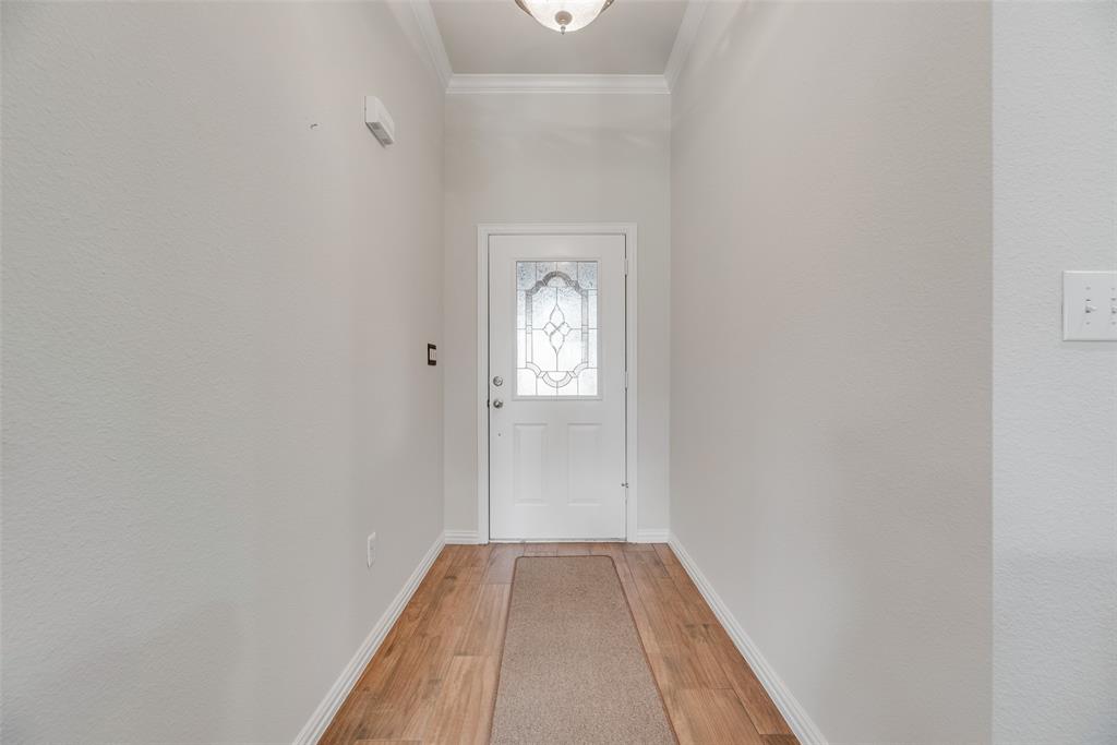 613 Torero Trail Oak Point, TX 75068 - Photo 19 of 32 a view of a livingroom with wooden floor and a window